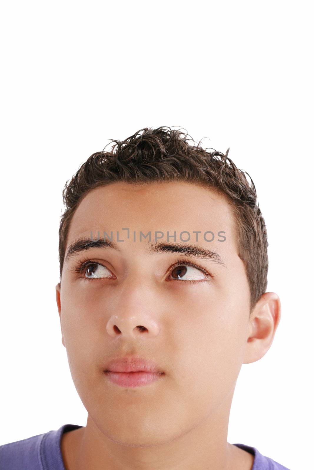 Young man looking up into open space. Isolated over white background.