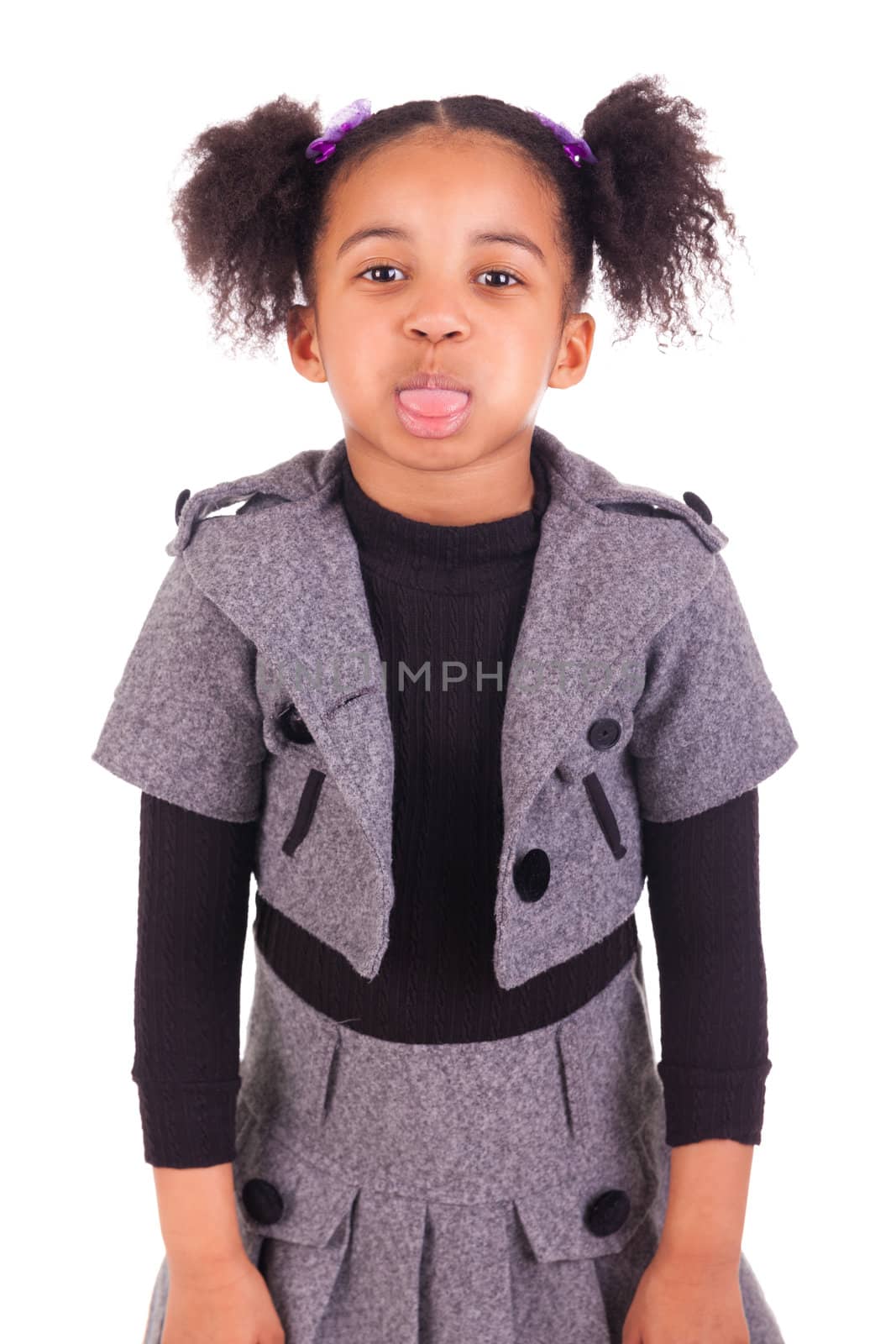 young African girl sticking tongue out, isolated on white background