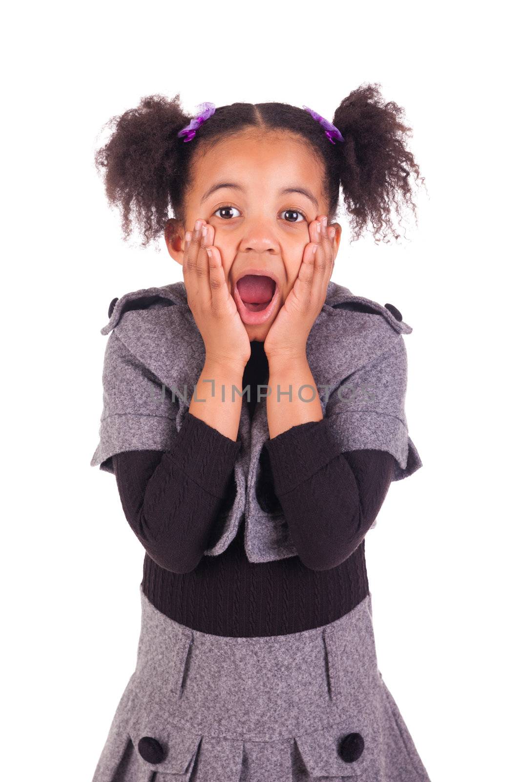 young African girl sticking tongue out, isolated on white background