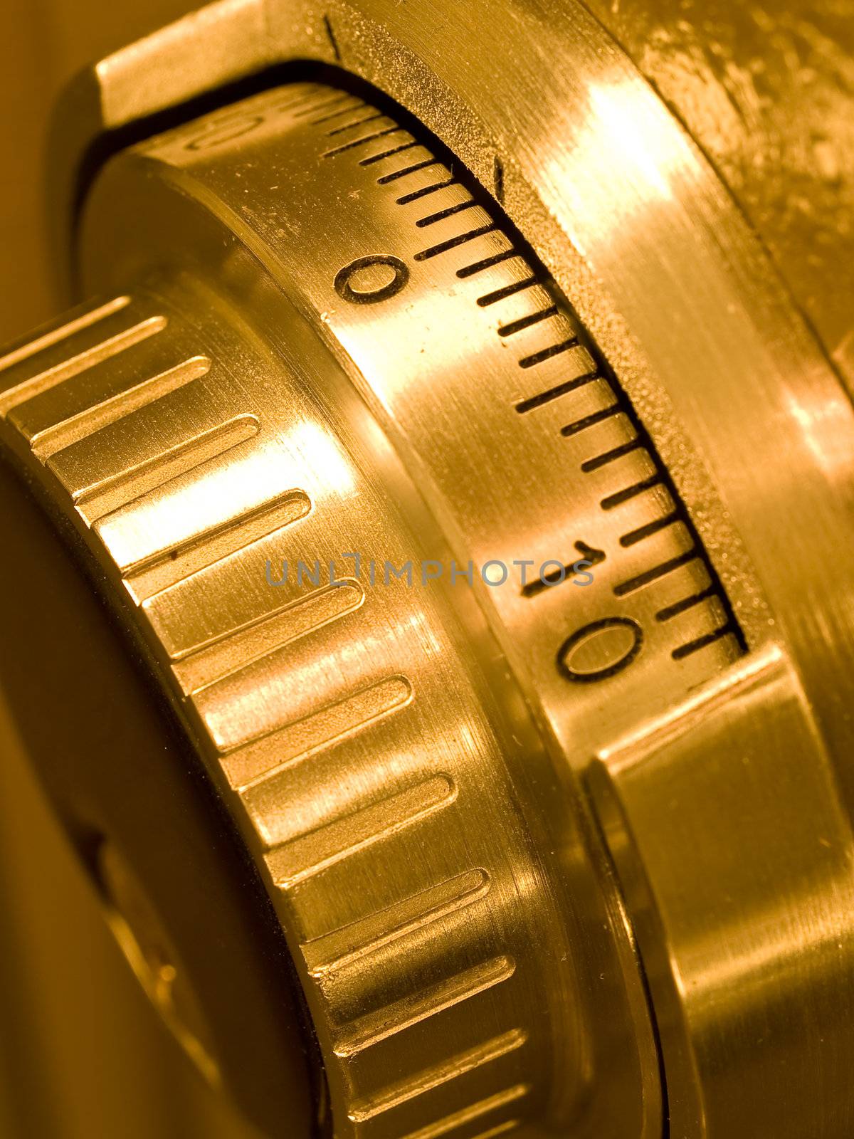 Closeup of a Safe Vault Combination Spinner - Gold Toned