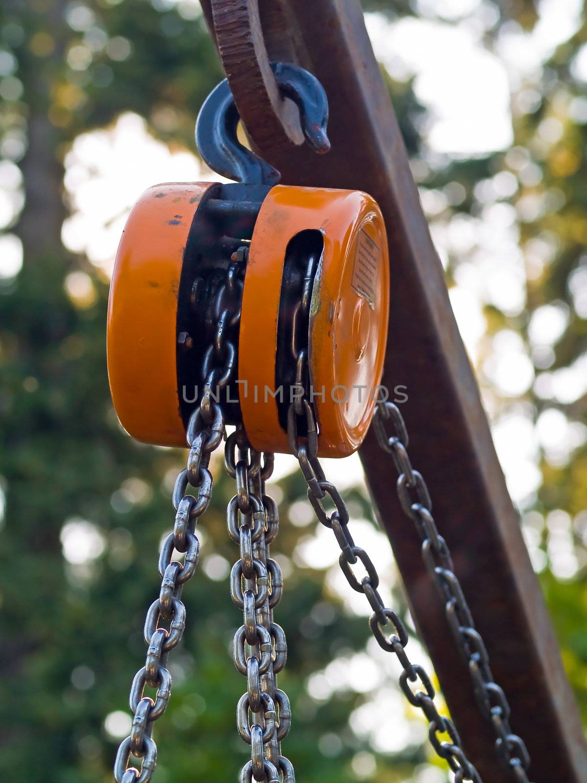 Large metal hook and chains attached to a pulley