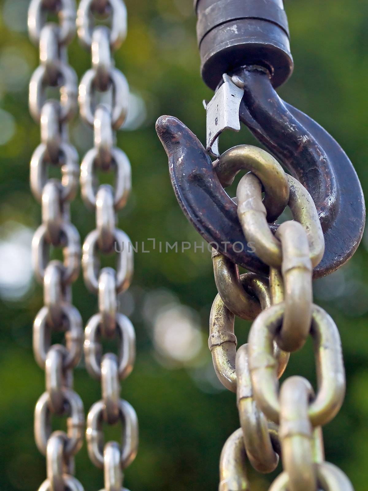 Large metal hook and chains attached to a pulley