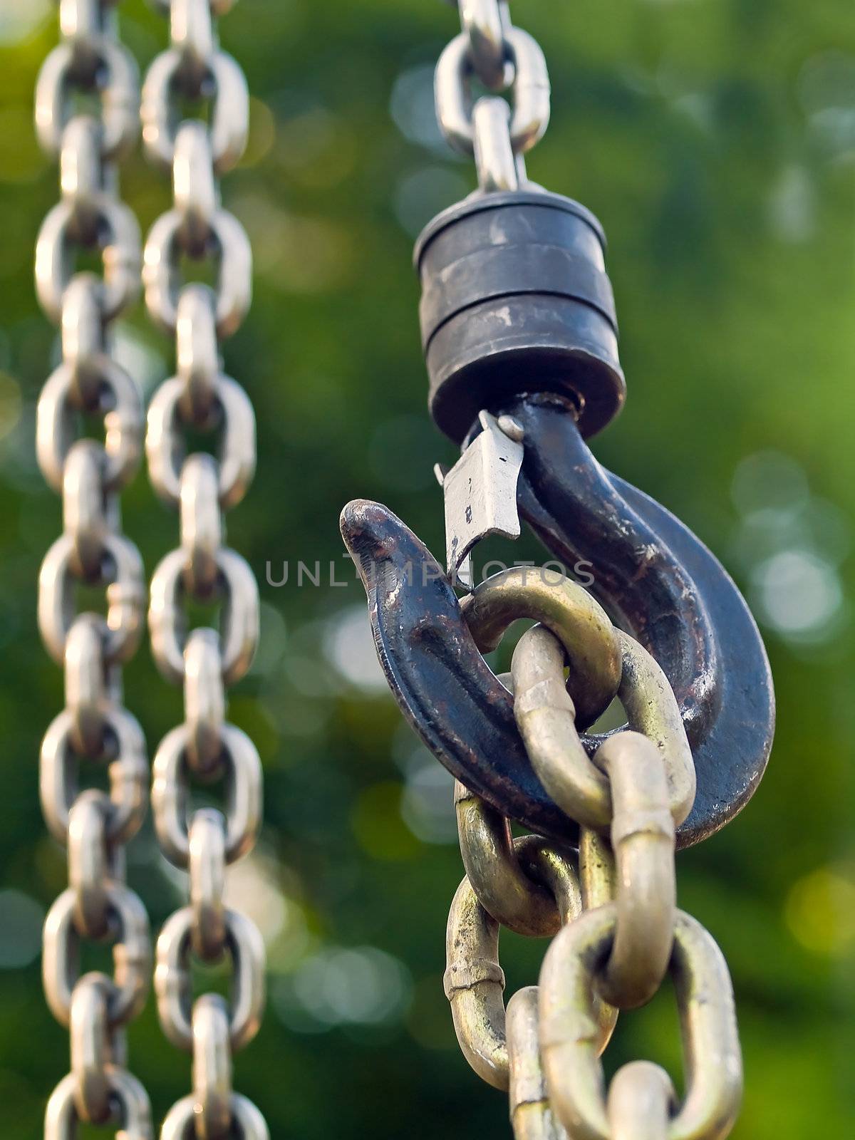 Large metal hook and chains attached to a pulley