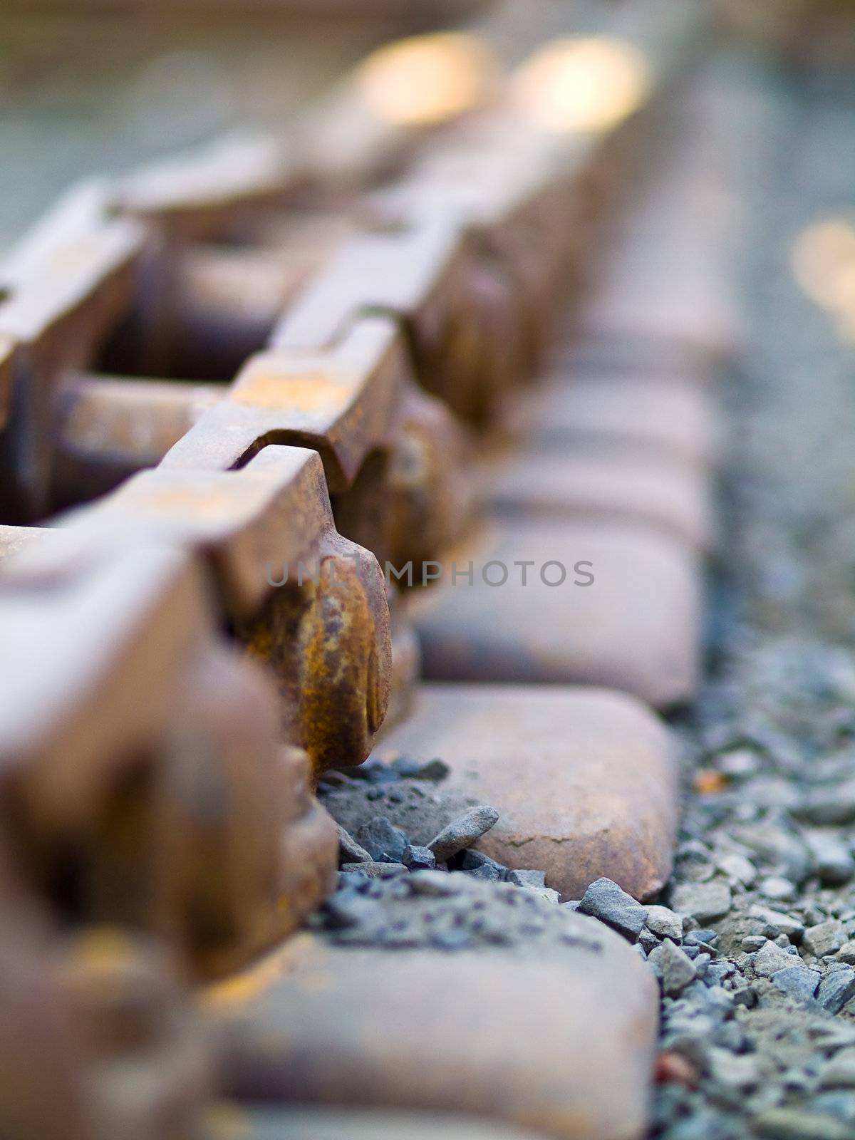 Old Rusty Continuous Tracks on Gravelly Ground