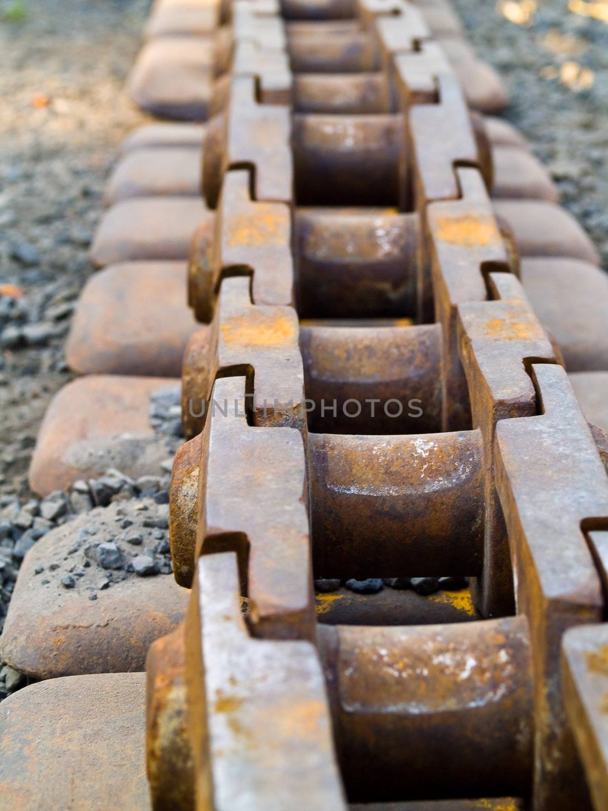 Old Rusty Continuous Tracks on Gravelly Ground
