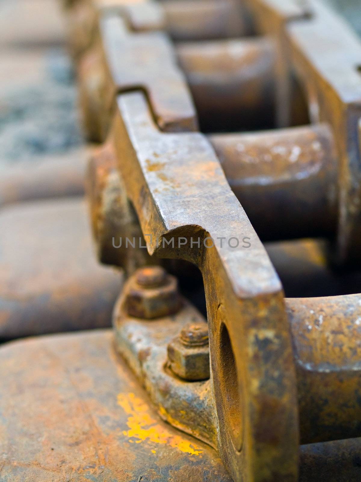 Old Rusty Continuous Tracks on Gravelly Ground