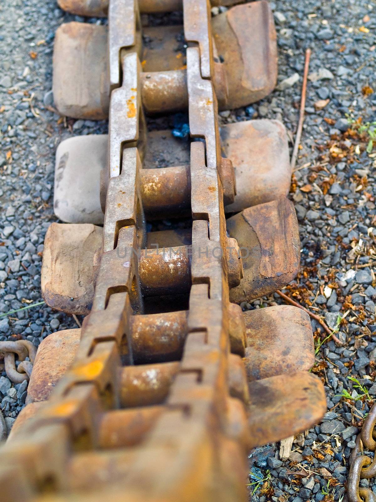 Old Rusty Continuous Tracks on Gravelly Ground