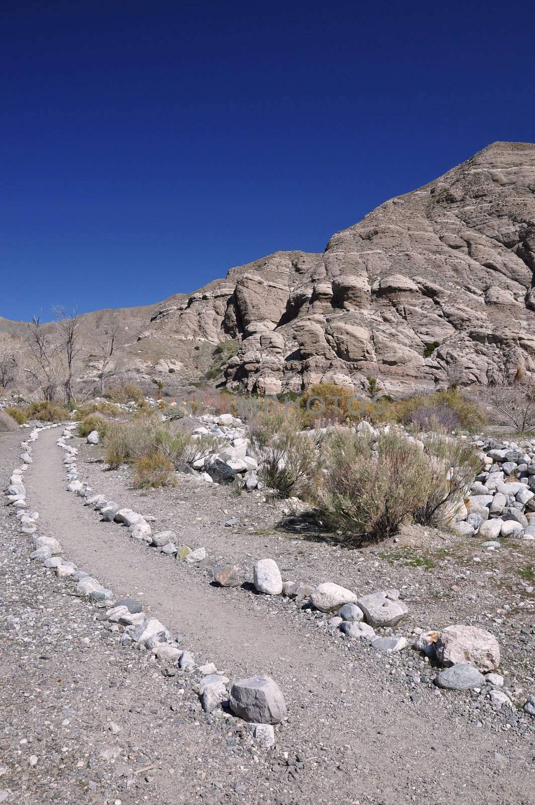 Rocks line a trail through the desert in Whitewater Canyon near the town of Palm Springs, California.