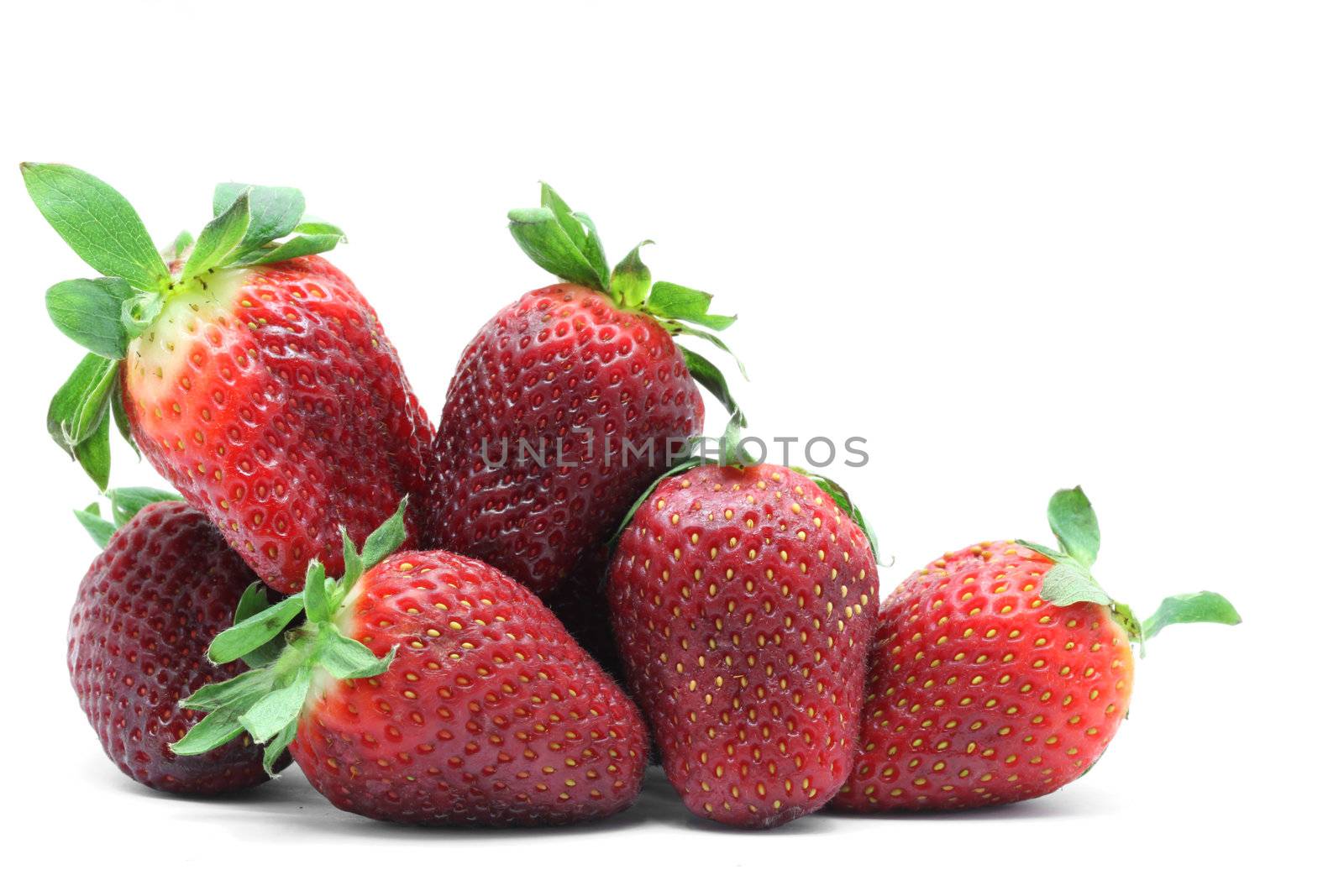 heap of strawberry fruit on white background