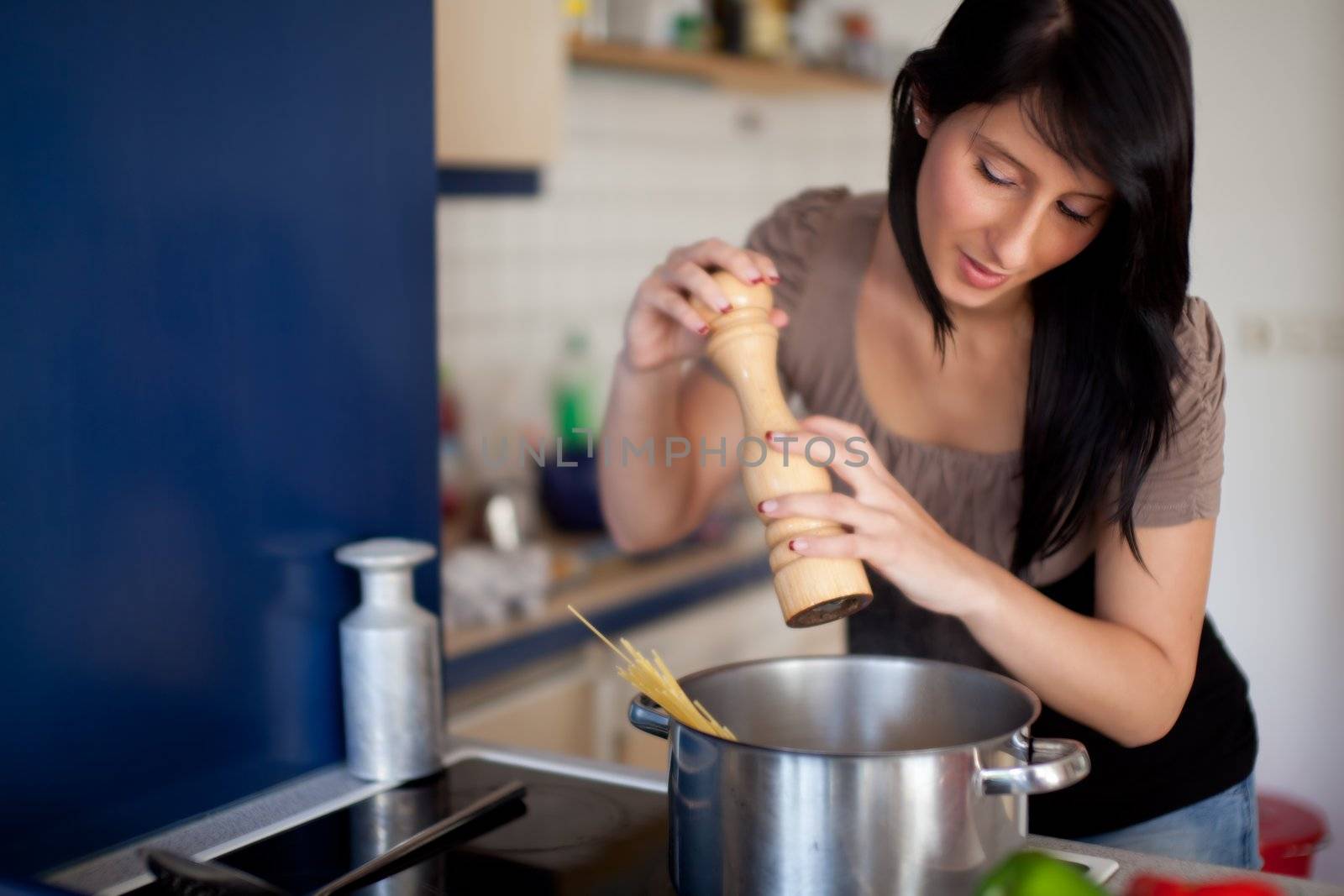 woman with a pepper mill