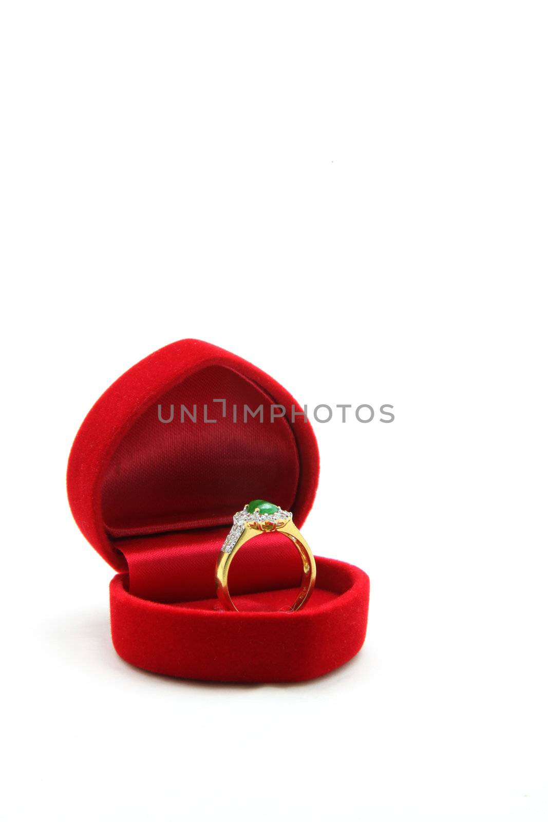 isolated female luxury diamond jade ring in red velvet box