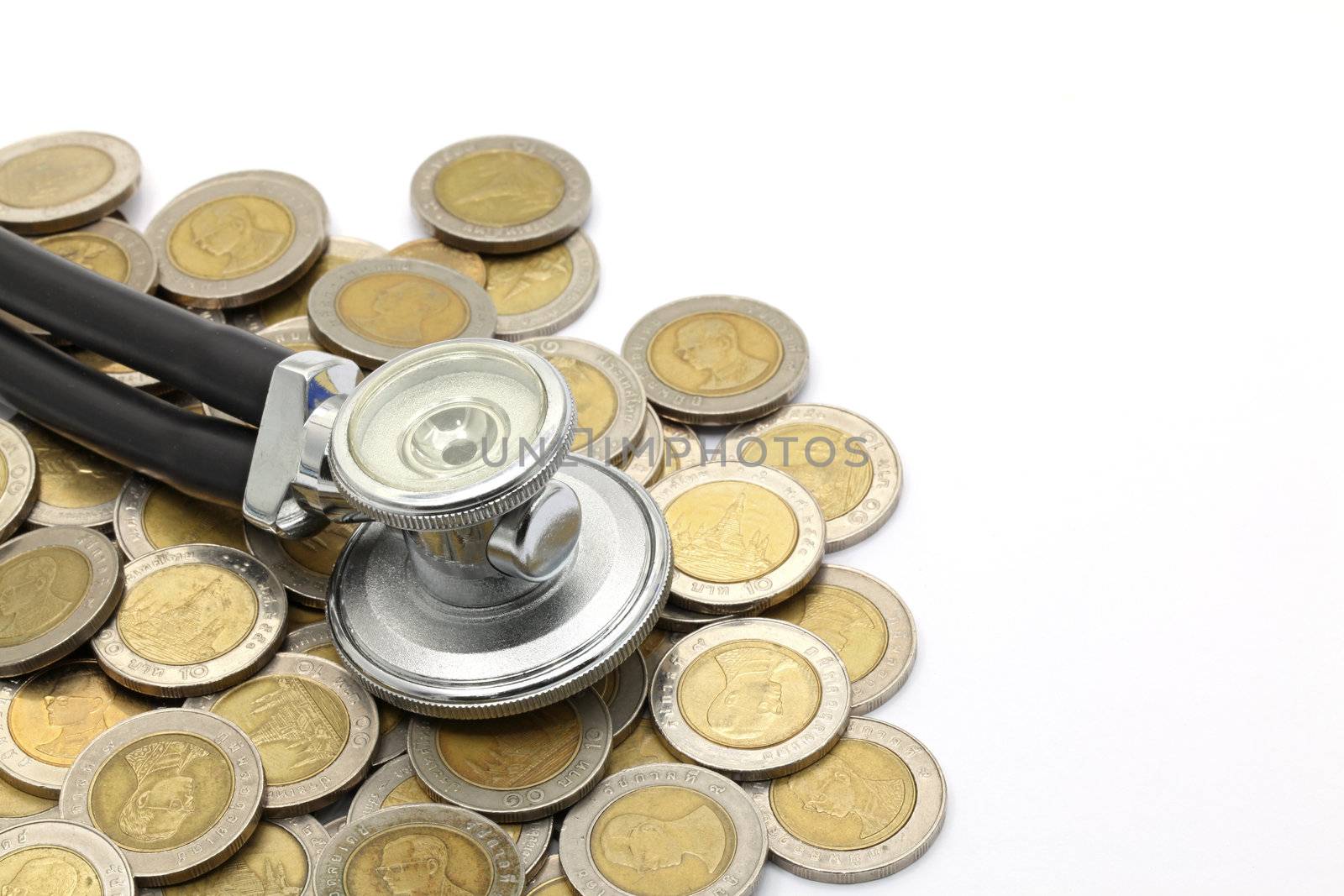 stethoscopeon currency coin for financial examination healthy concept