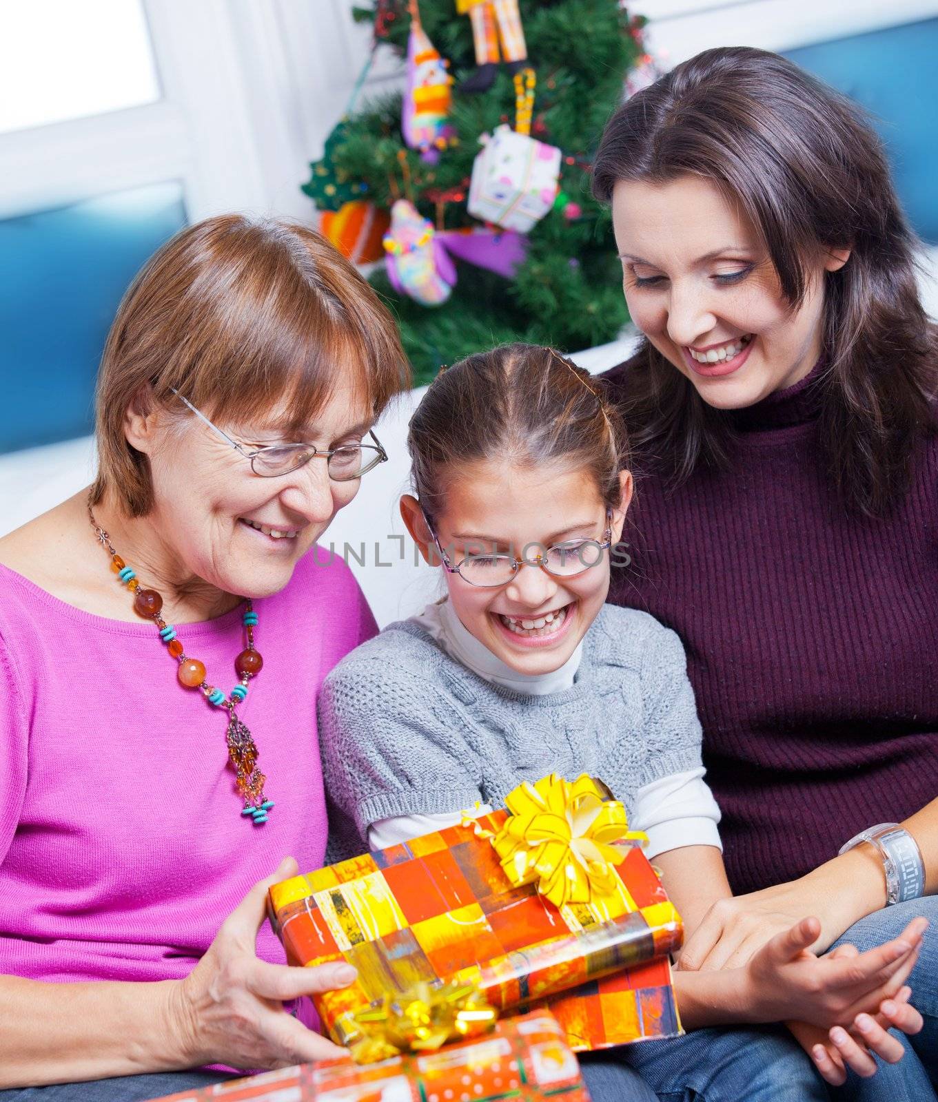 Girl and her mother and grandmother with gifts by maxoliki