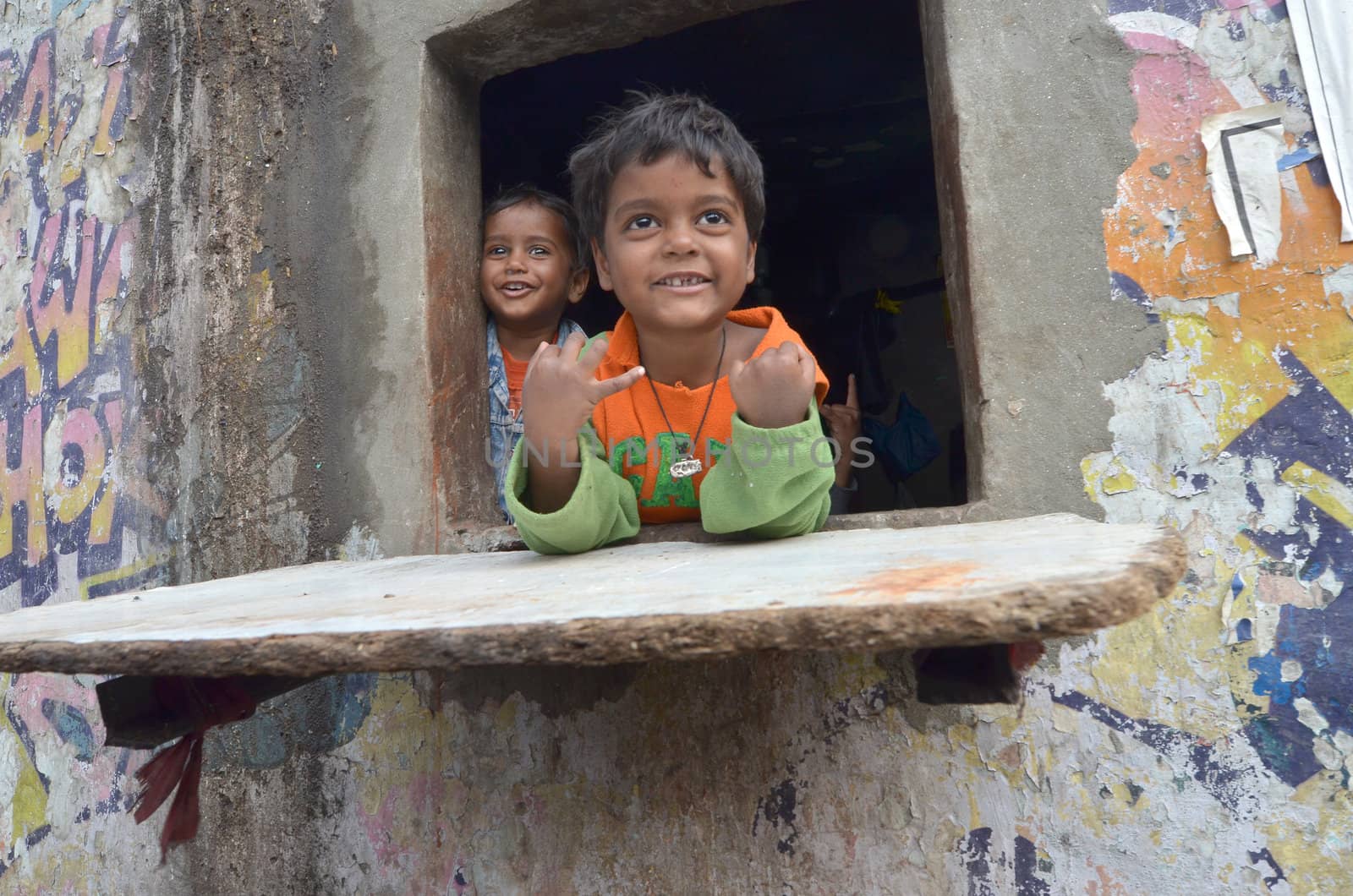 New Delhi,India-February 4, 2013:a  unidentified child playing the poorest district of New Delhi in February 4,2013 New Delhi dramatically increases the number of poor people living in slums