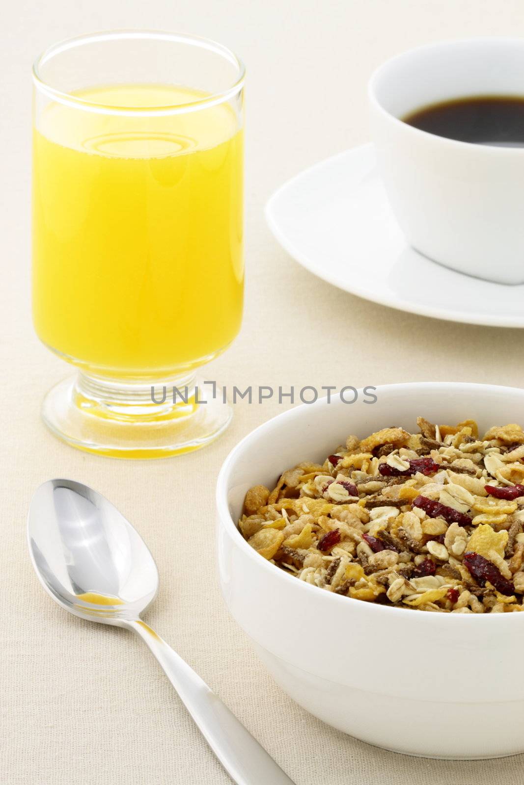 delicious breakfast with fresh orange juice, hot coffee and a healthy bowl of cereal.