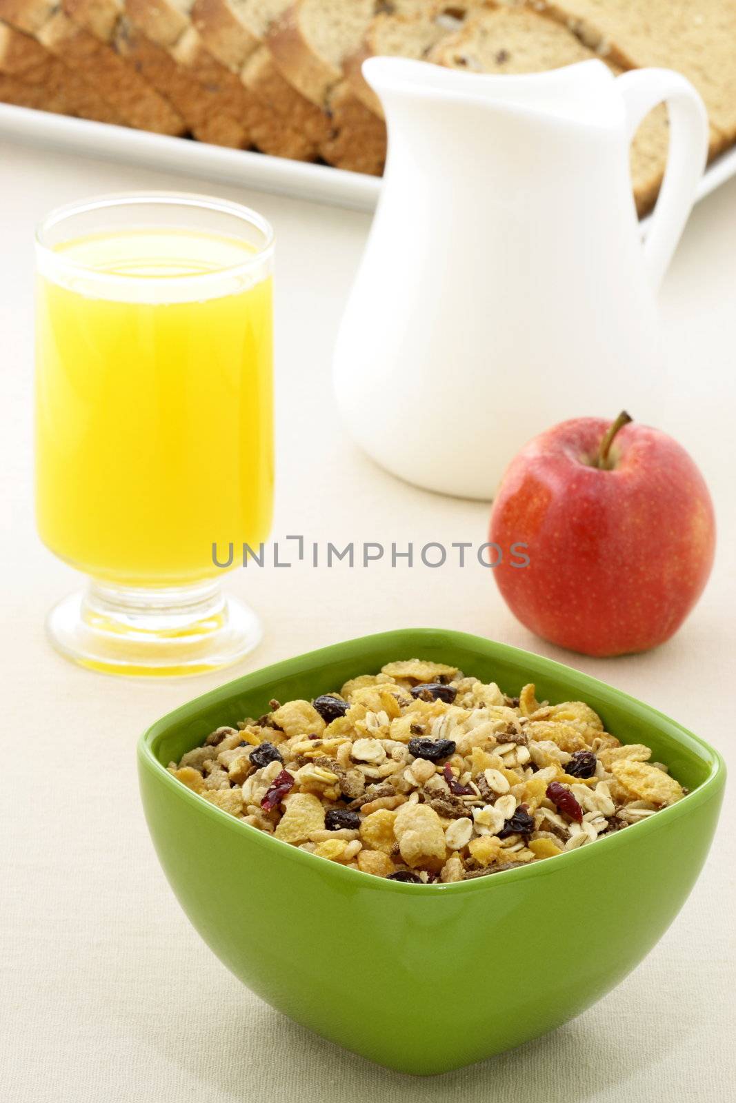 delicious breakfast with whole grain bread,fresh red apple and a healthy bowl of muesli cereal.