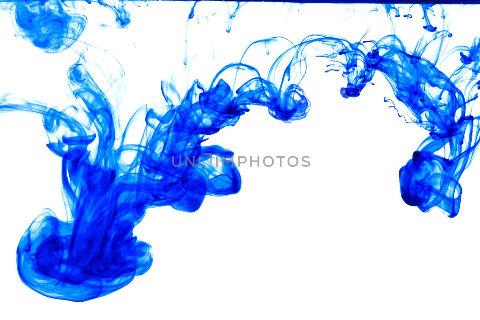 Blue ink isolated dissolving in water