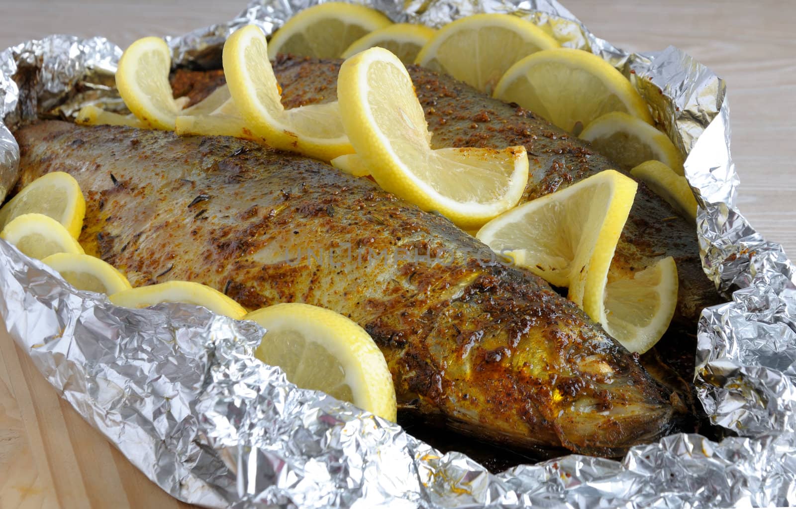 Baked herring in spices and herbs in foil by Apolonia