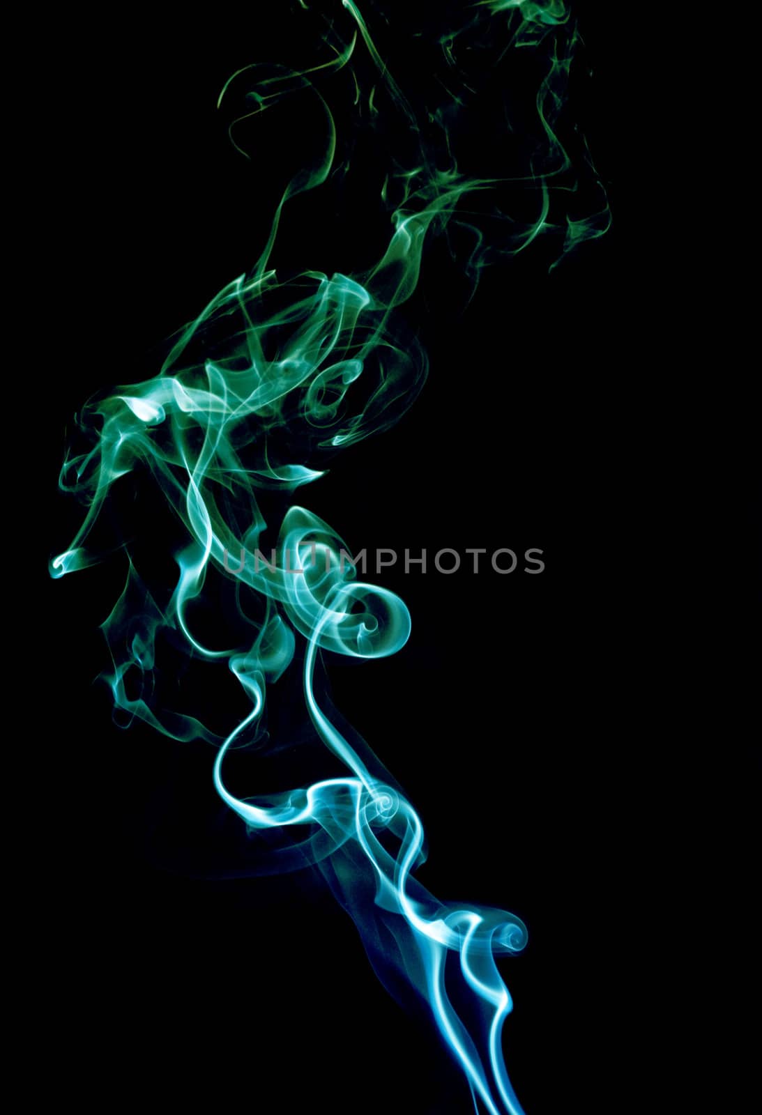 Blue and green abstract smoke on black