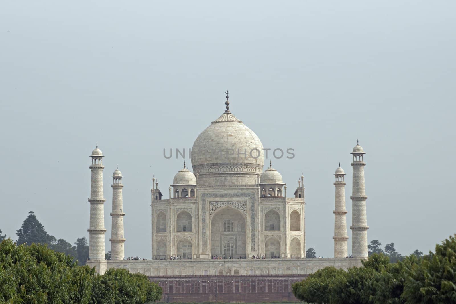 Taj Mahal. White marble tomb set on raised platform topped by large oval dome. Agra, Uttar Pradesh. India