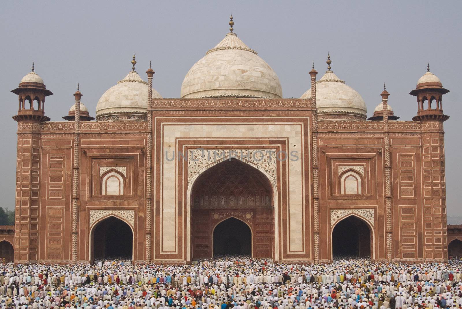 Thousands of people gather in front of the mosque at the Taj Mahal to celebrate the Muslim festival of Eid ul-Fitr in Agra, Uttar Pradesh, India