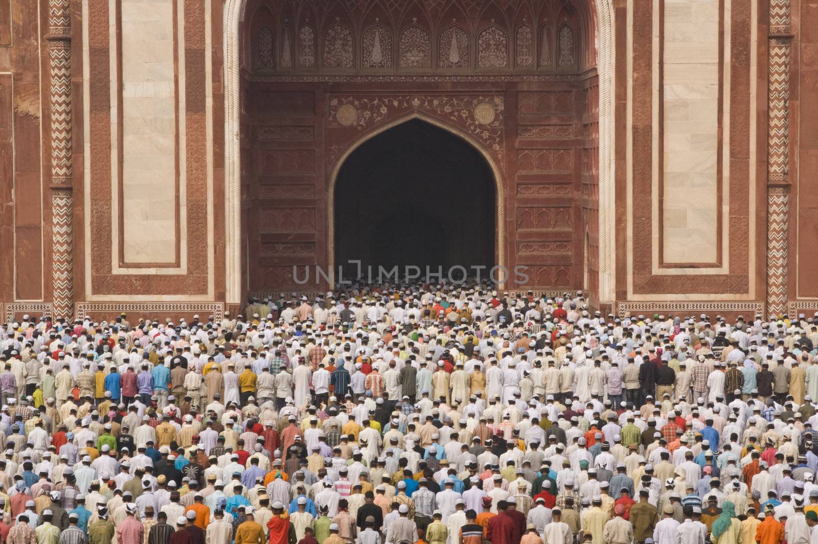 Thousands of people gather in front of the mosque at the Taj Mahal to celebrate the Muslim festival of Eid ul-Fitr in Agra, Uttar Pradesh, India