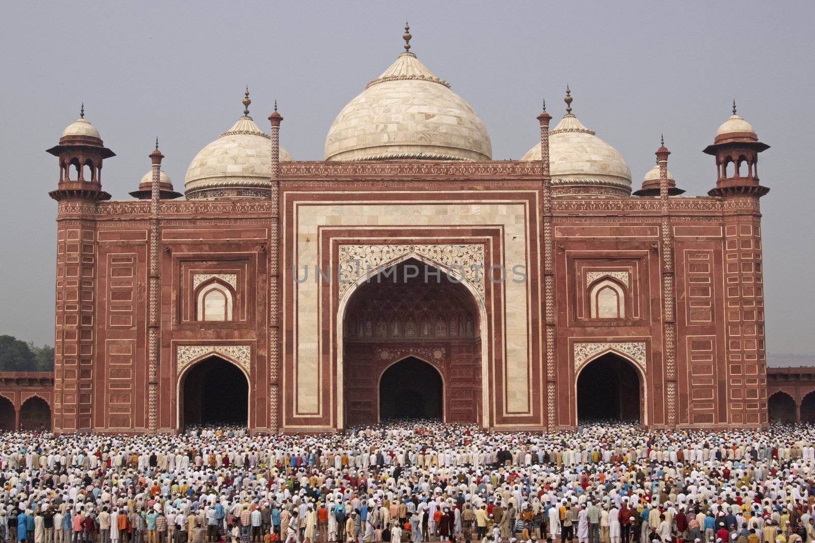 Thousands of people gather in front of the mosque at the Taj Mahal to celebrate the Muslim festival of Eid ul-Fitr in Agra, Uttar Pradesh, India