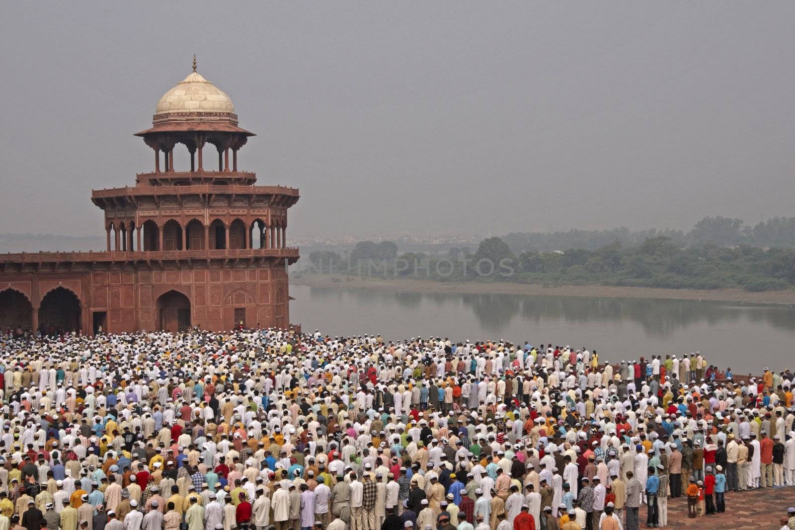 Thousands of people gather in front of the mosque at the Taj Mahal to celebrate the Muslim festival of Eid ul-Fitr in Agra, Uttar Pradesh, India