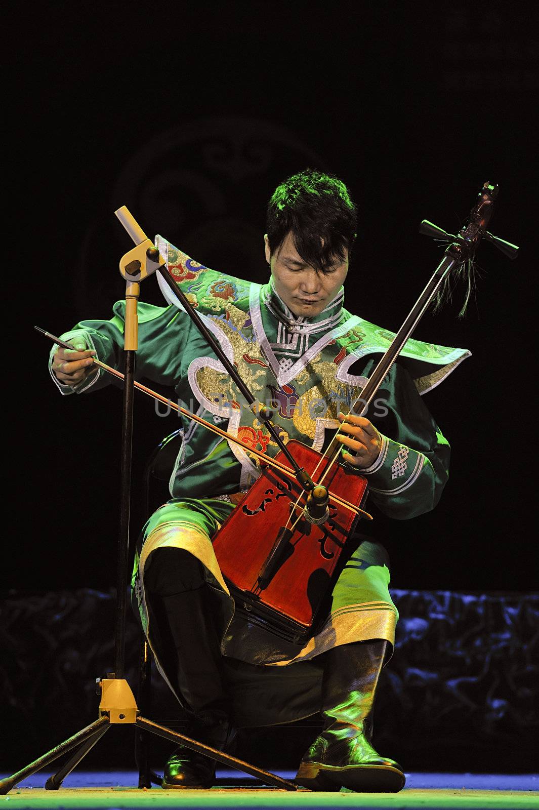 CHENGDU - SEP 28: Mongolian ethnic musician performs on stage in the 6th Sichuan minority nationality culture festival at JINJIANG theater.Sep 28,2010 in Chengdu, China.