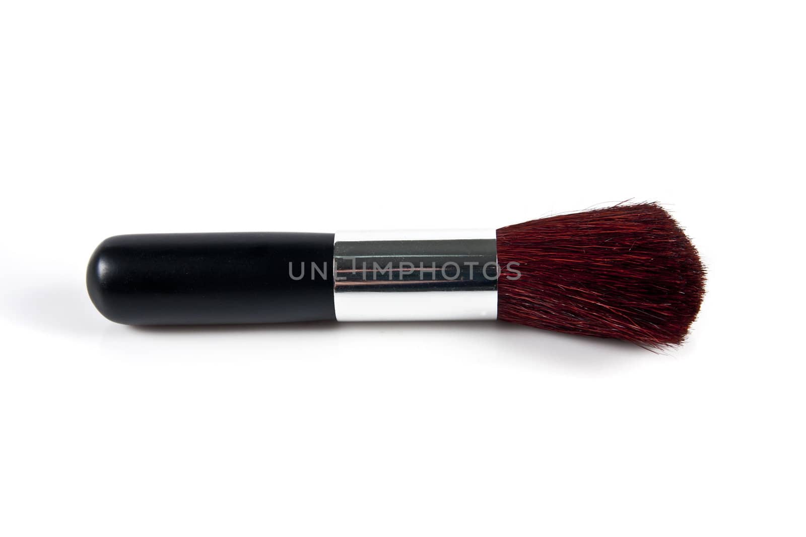 Cosmetic brush on white background