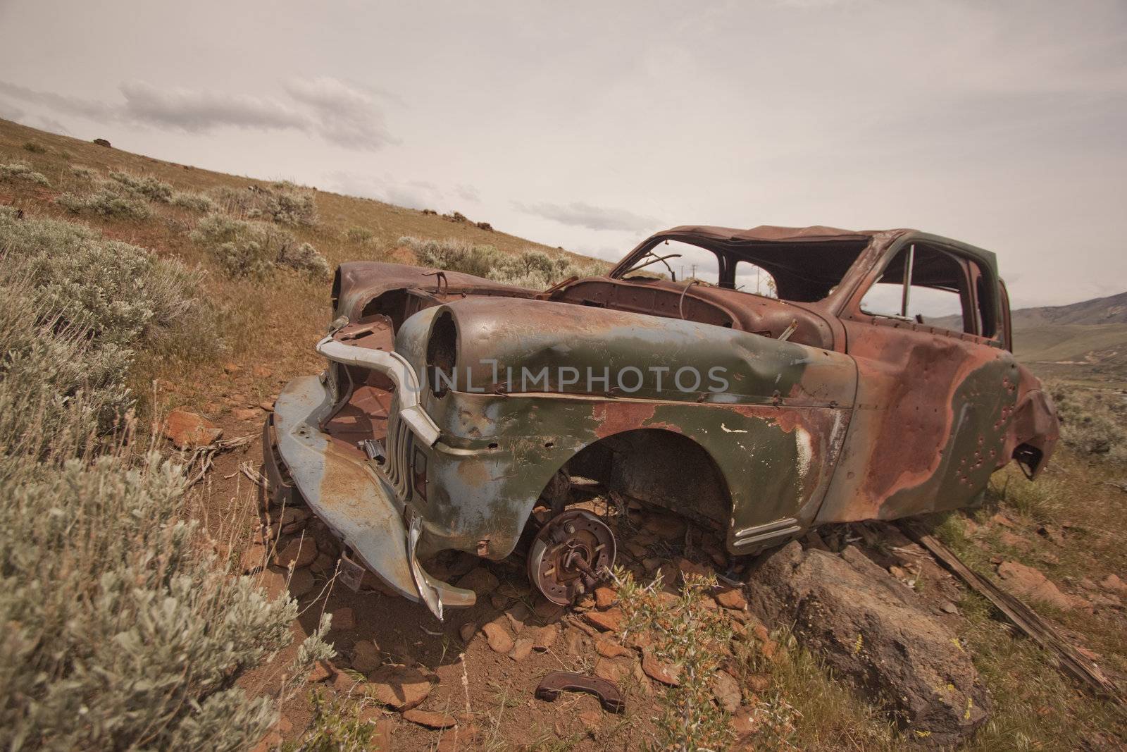 Old abandoned car with bullet holes. Reno Nevada high desert