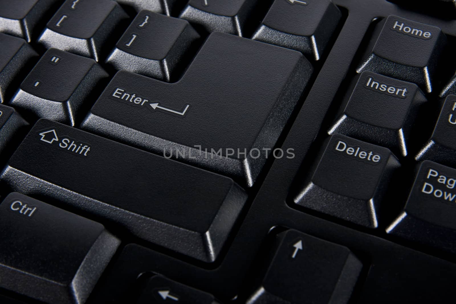 Close up enter key on black computer keyboard