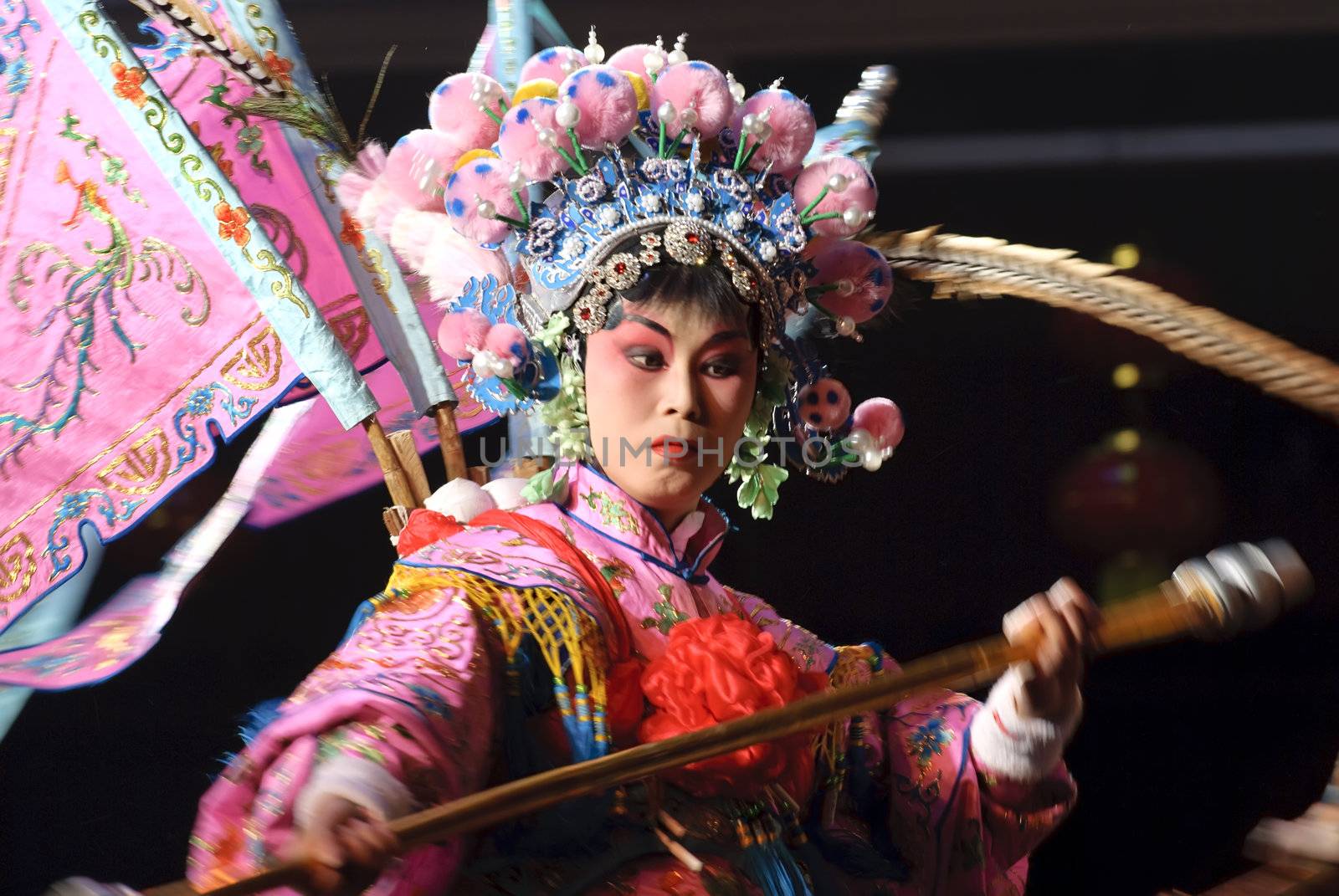 chinese traditional opera actress with theatrical costume performs on stage