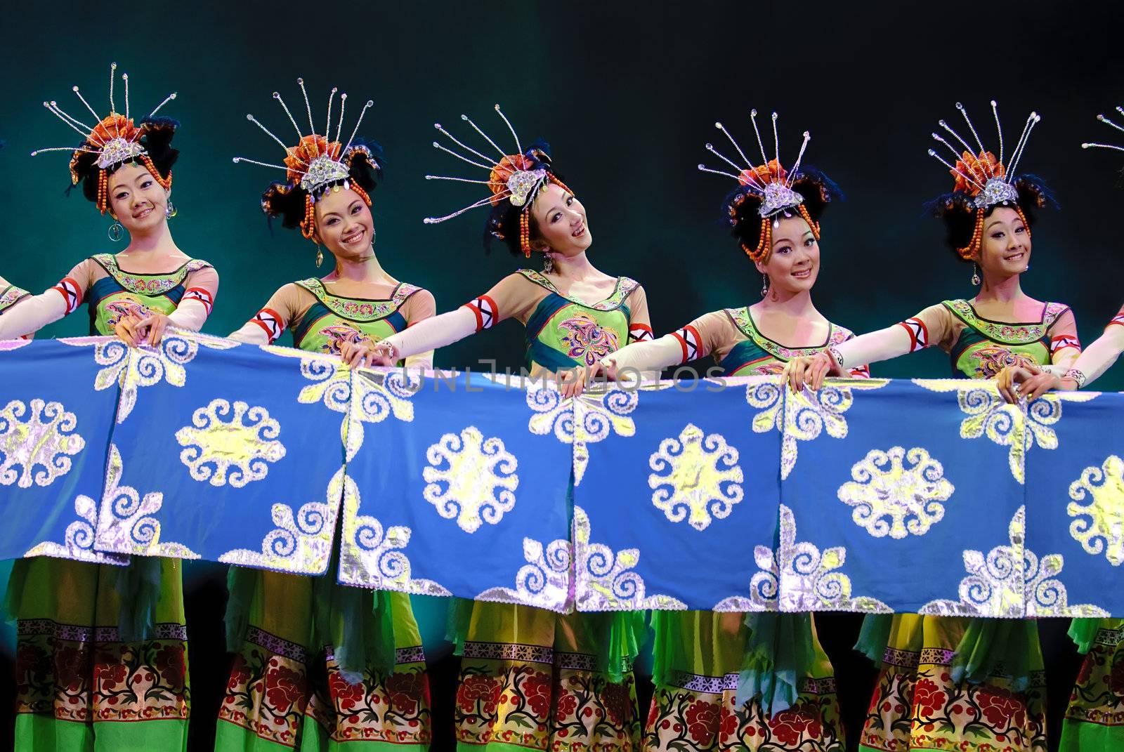 CHENGDU - DEC 13: chinese Yi ethnic dancers perform folk group dance on stage at JINCHENG theater in the 7th national dance competition of china on Dec 13,2007 in Chengdu, China.