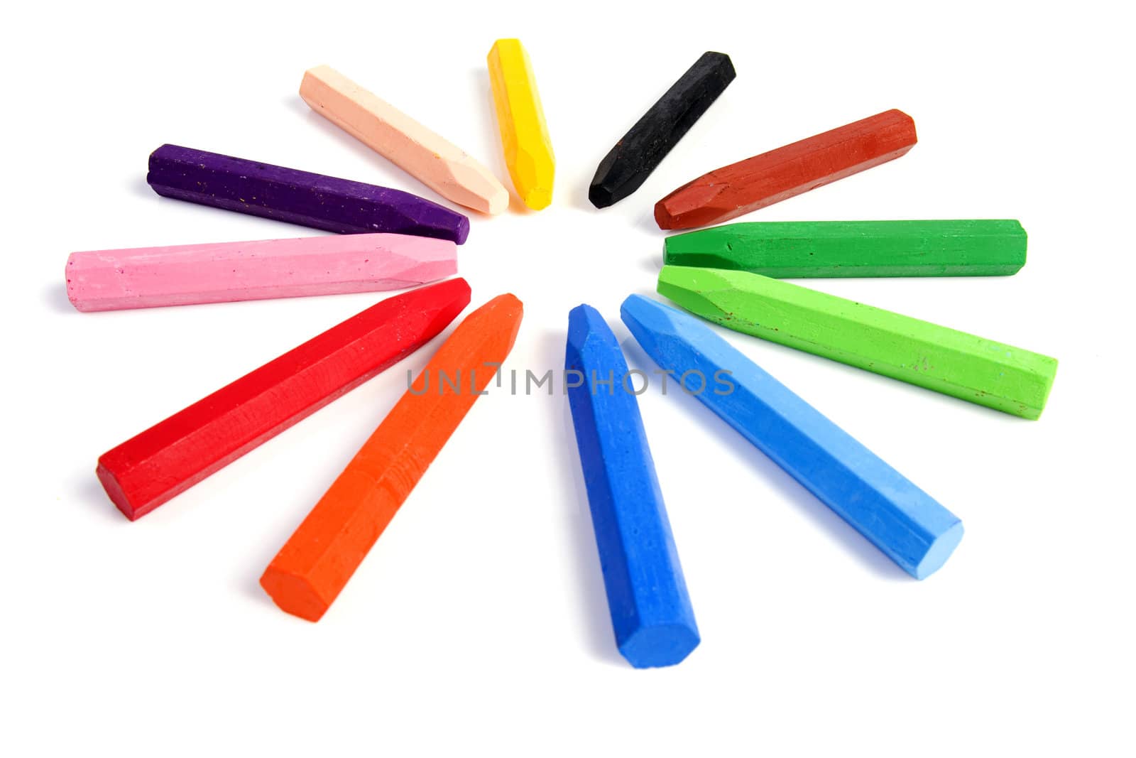 Colored wax crayons isolated on white background