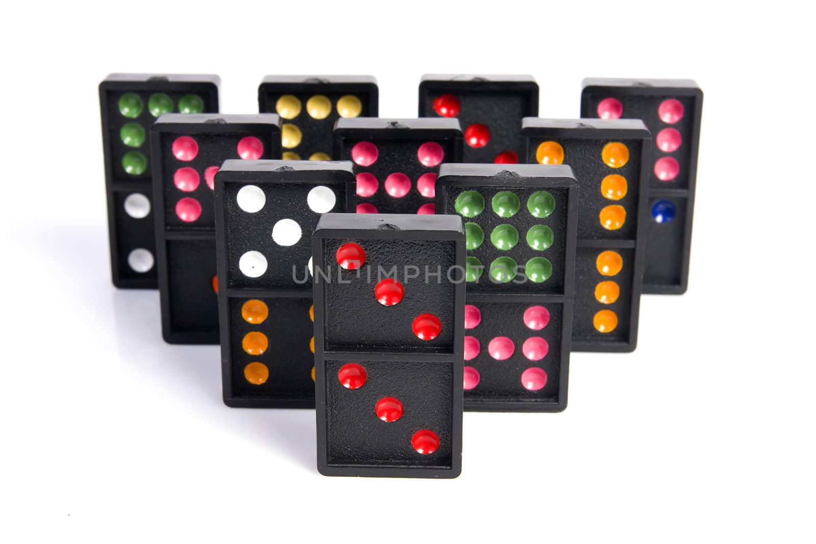 Domino pyramid on white background. Leisure and game concept.