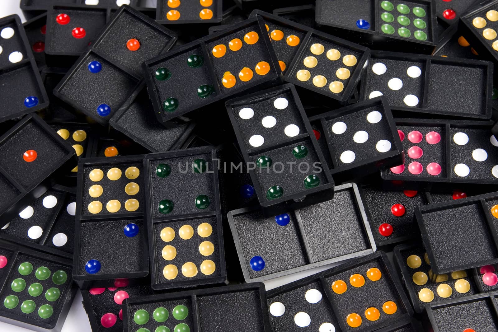 Domino pieces randomly spread on white background. Leisure and game concept.