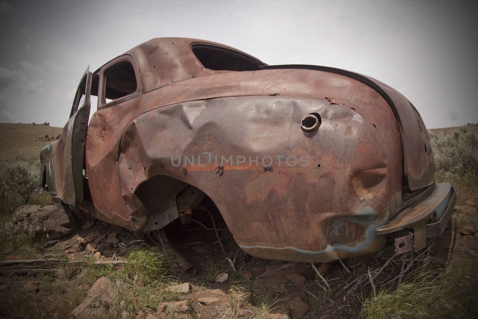 Old abandoned car with bullet holes. Reno Nevada high desert