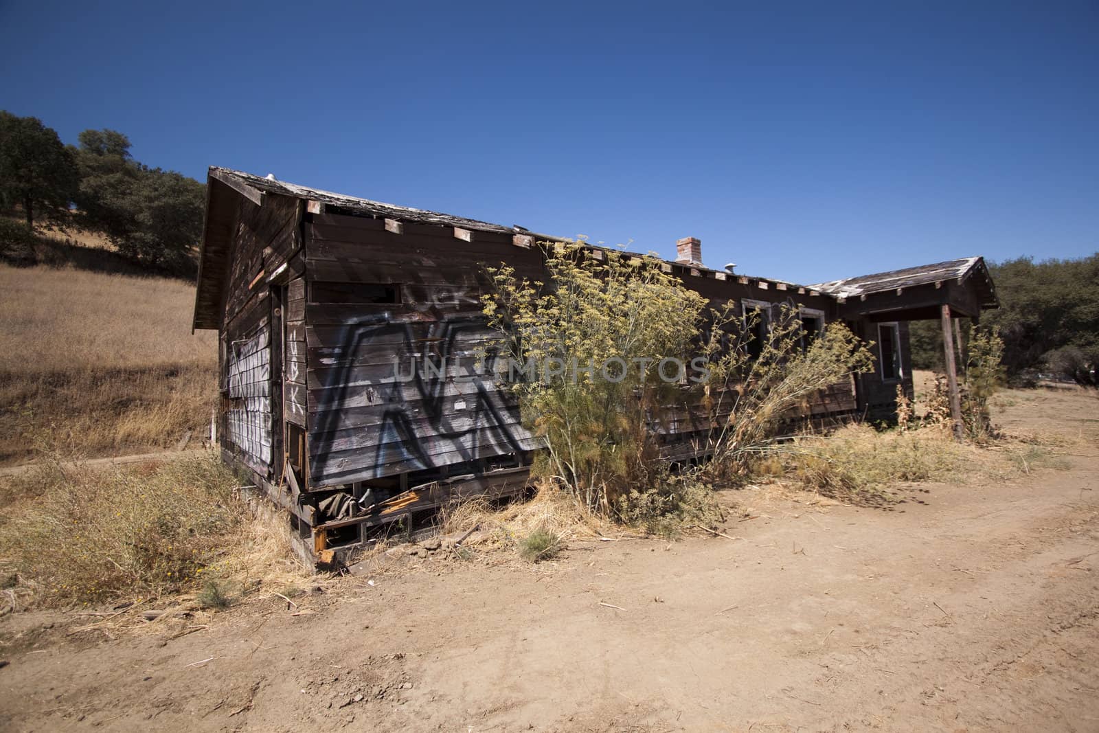 Old barn house with a blue clear sky