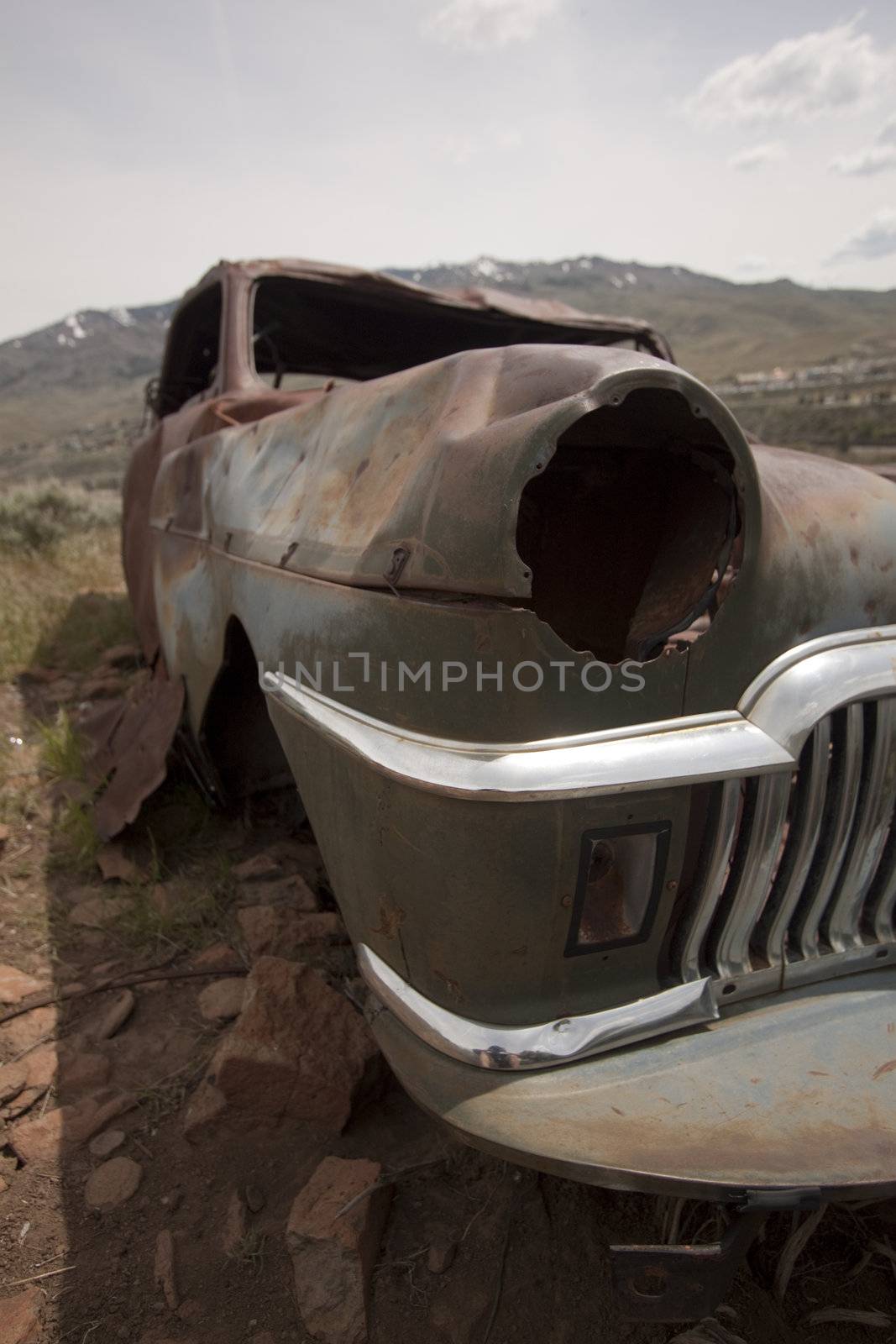 Old abandoned car with bullet holes. Reno Nevada high desert