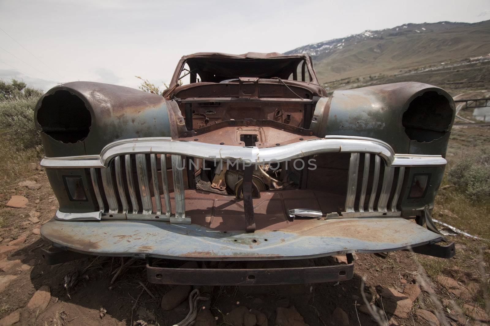 Old abandoned car with bullet holes. Reno Nevada high desert