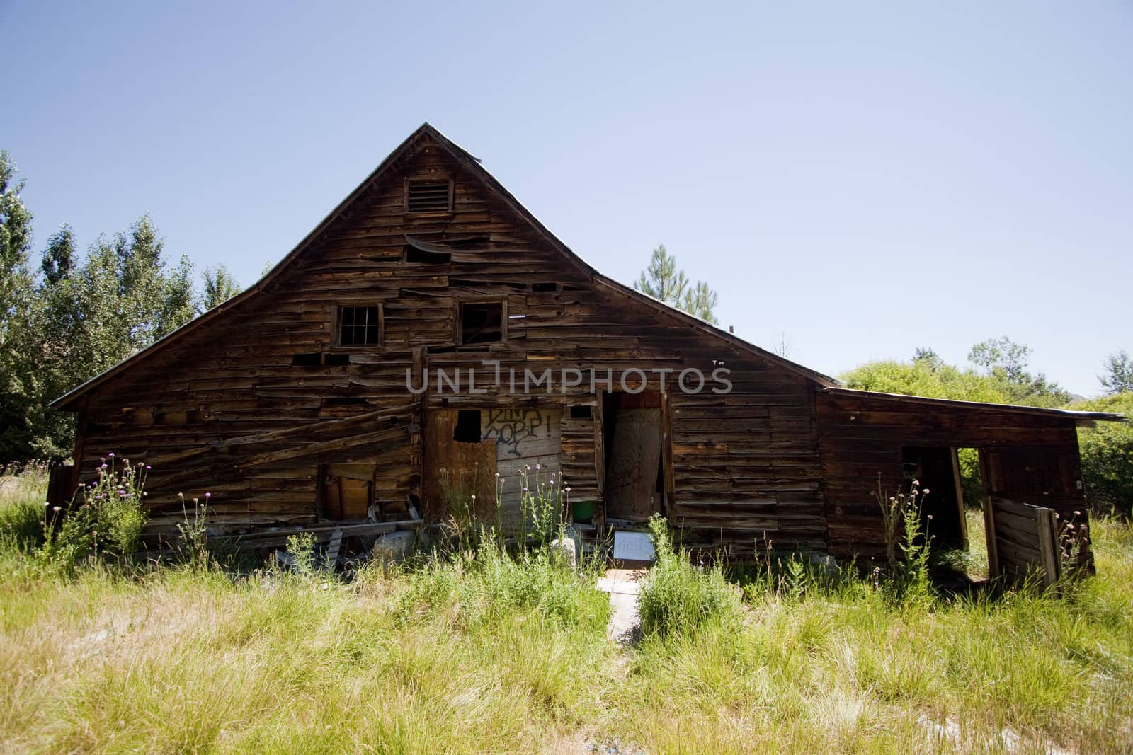 Old barn house with a blue clear sky