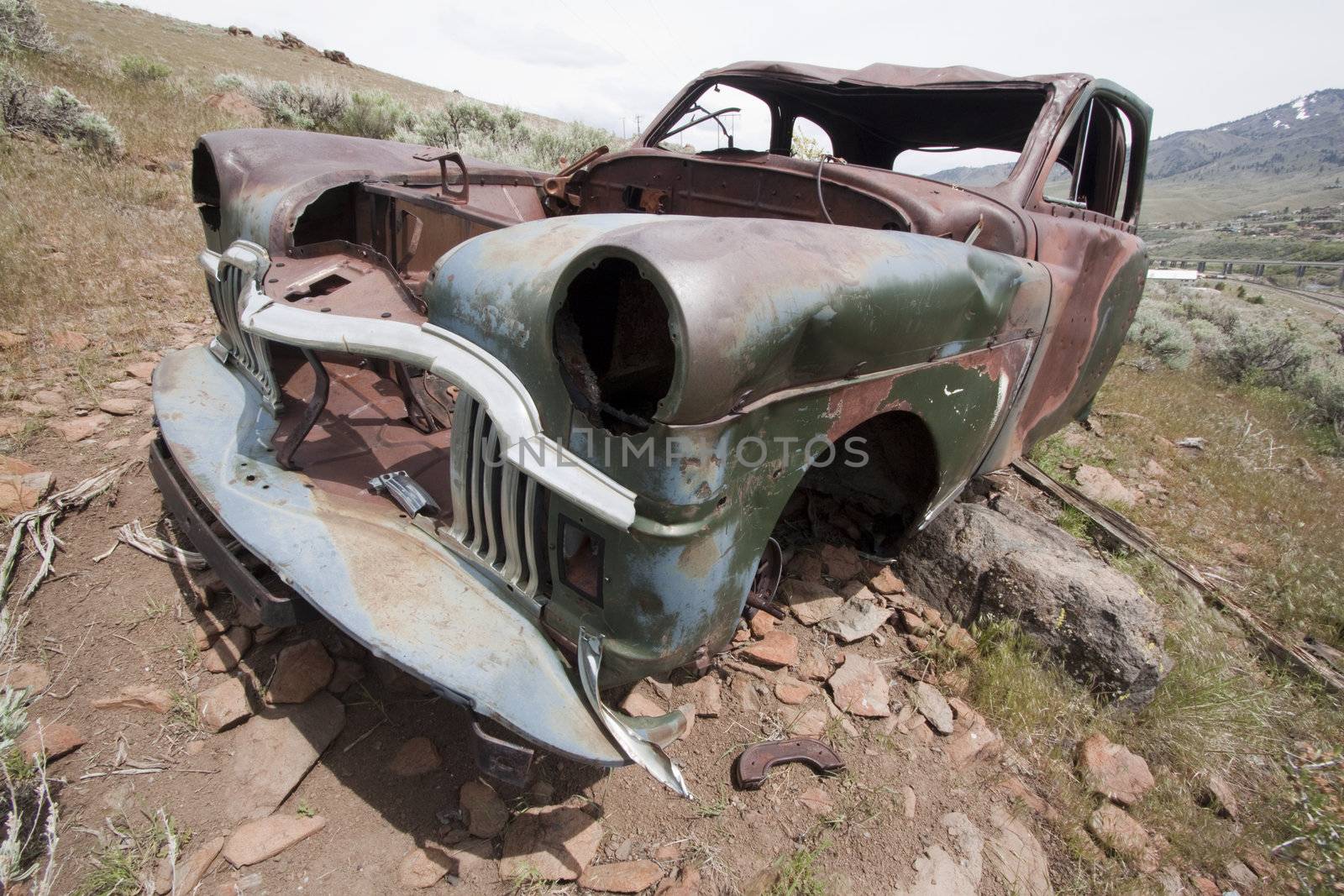 Old abandoned car with bullet holes. Reno Nevada high desert