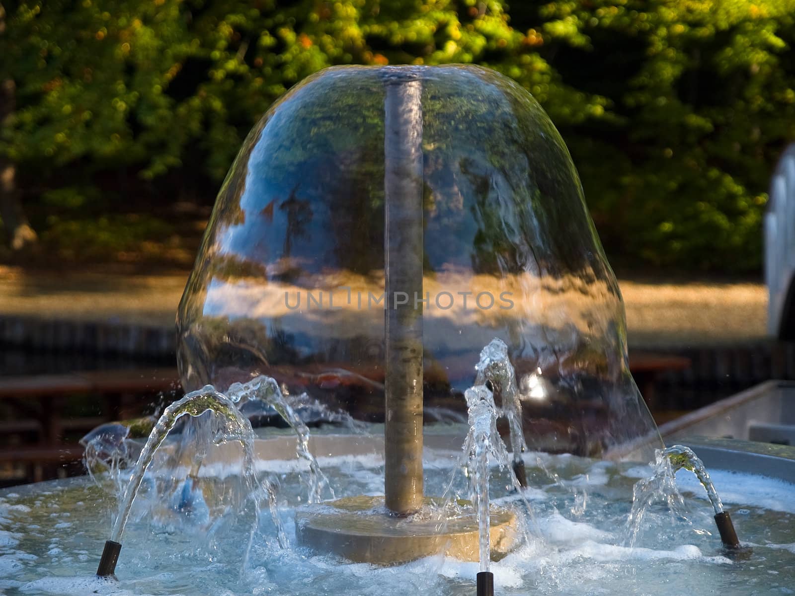 Closeup view of a decorative garden water fountain with effect of frozen flow