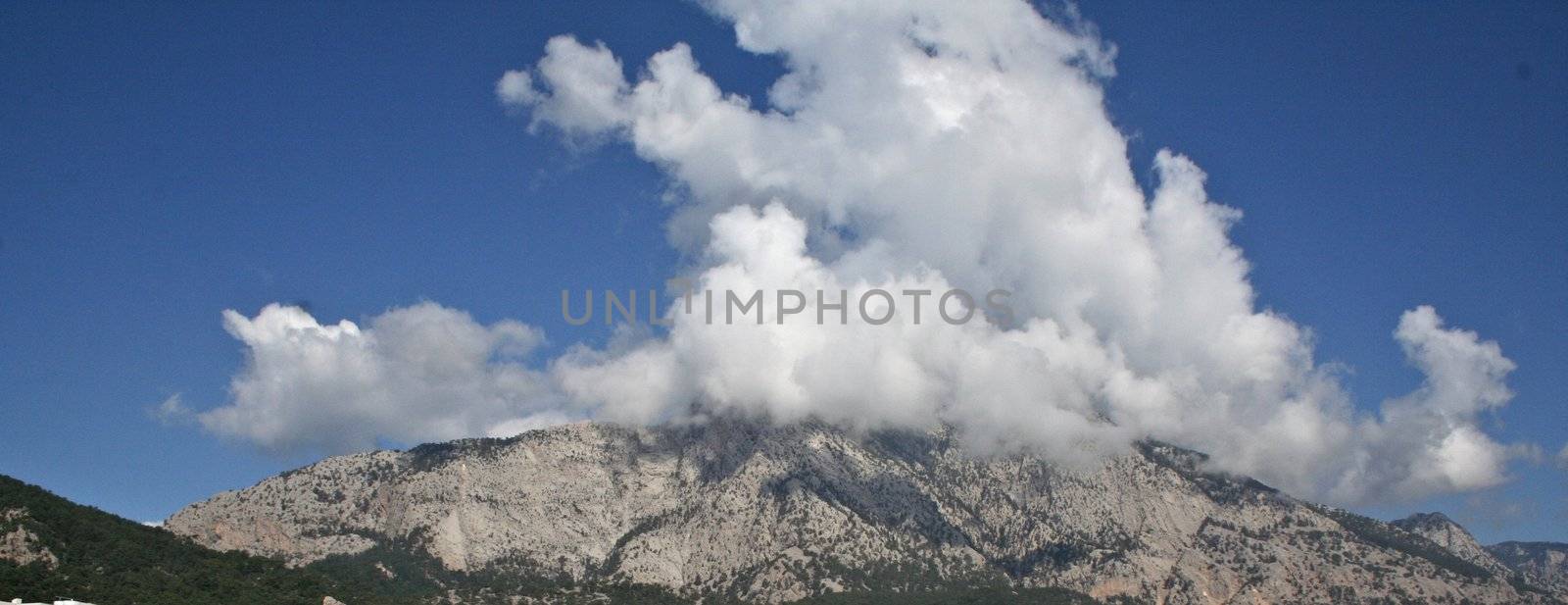 Mountains in clouds background nature texture close up