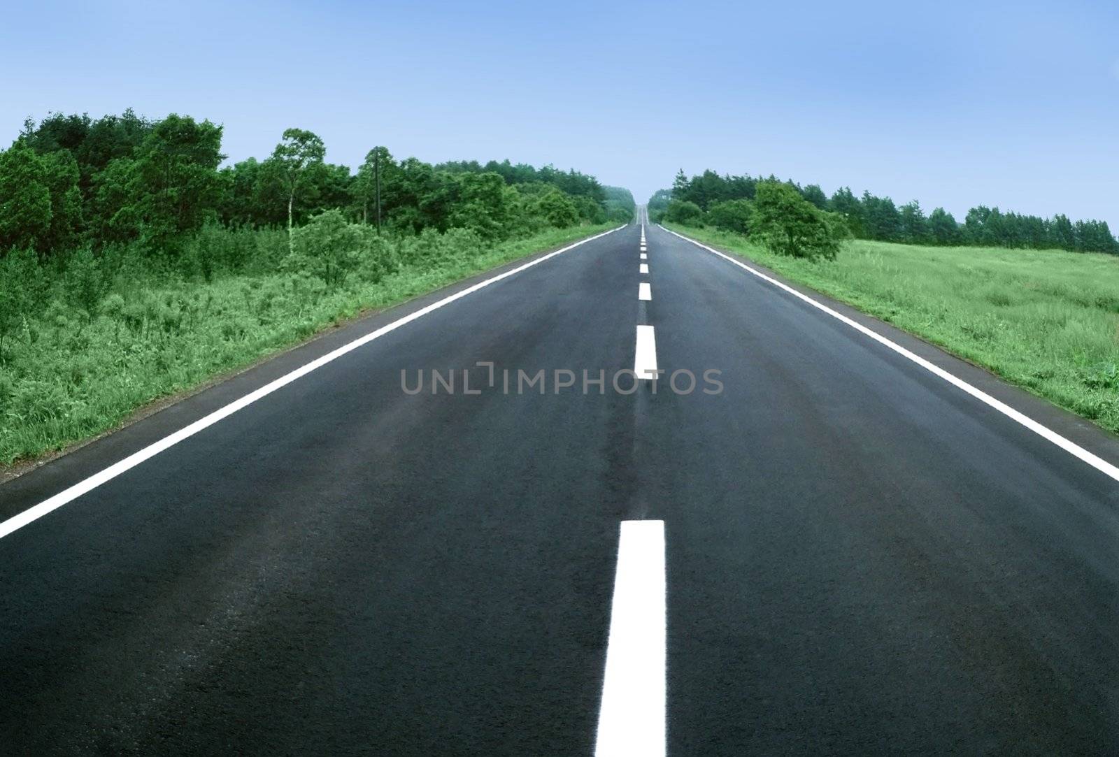 Picture of empty countryside road and blue sky