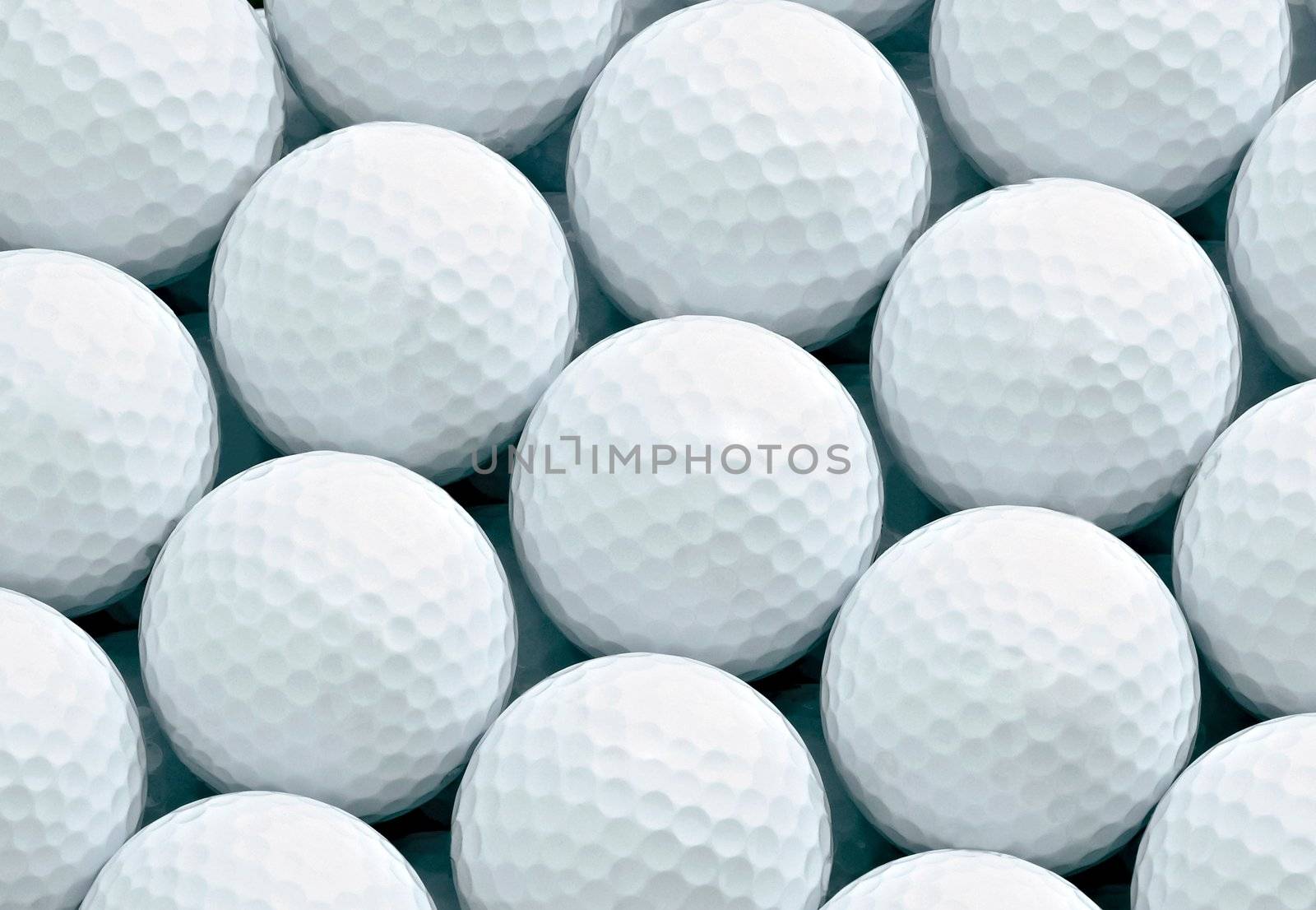 Macro shot of golf ball by ozaiachin