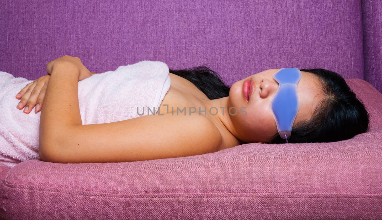 Cute Asian-Thai Girl with eyes gel mask which covering the upper part of the face but with holes for the eyes