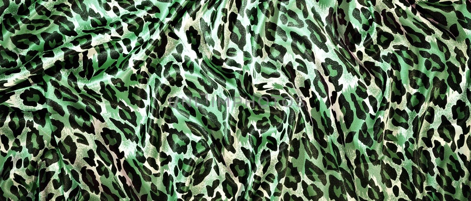 Silk leopard print fabric close up background