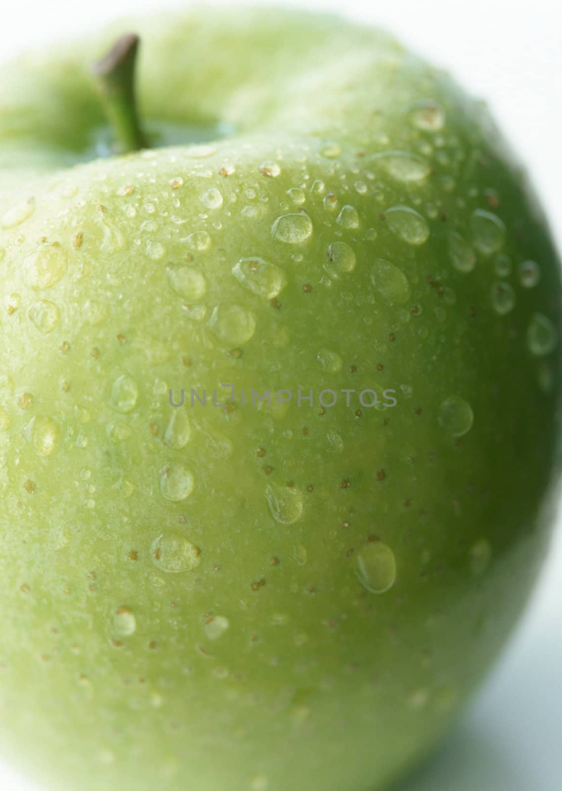 fresh green apple isolated on white by ozaiachin